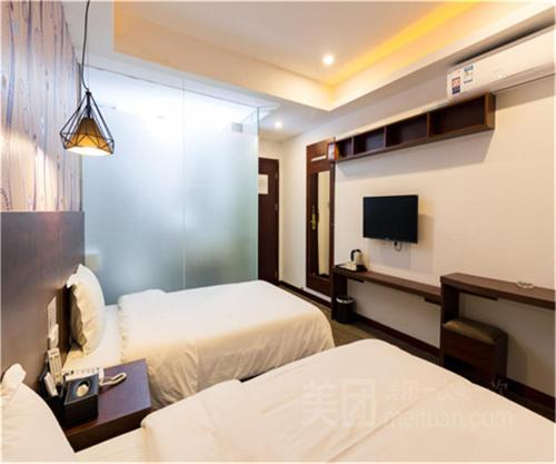 Imagen de la habitación del Hotel Yimi Guangzhou Exhibition Center. Foto 7