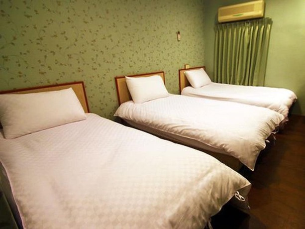 Imagen de la habitación del Hotel Yinglun Hotel. Foto 2