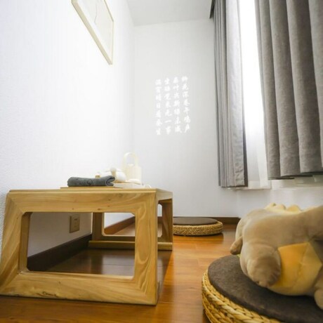 Imagen de la habitación del Hotel Yinlu Bedroom Fenghuang Hongqiao Shop. Foto 19