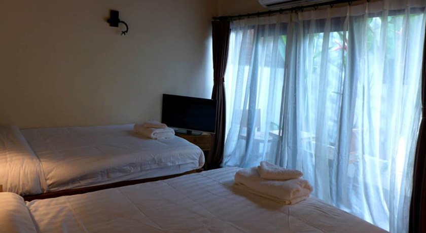 Imagen de la habitación del Hotel Yi's Garden Villa. Foto 6