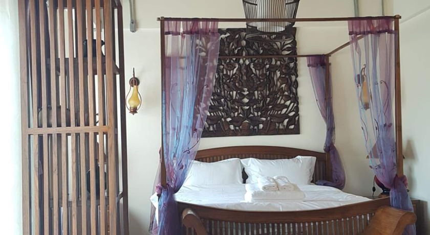 Imagen de la habitación del Hotel Yi's Garden Villa. Foto 8