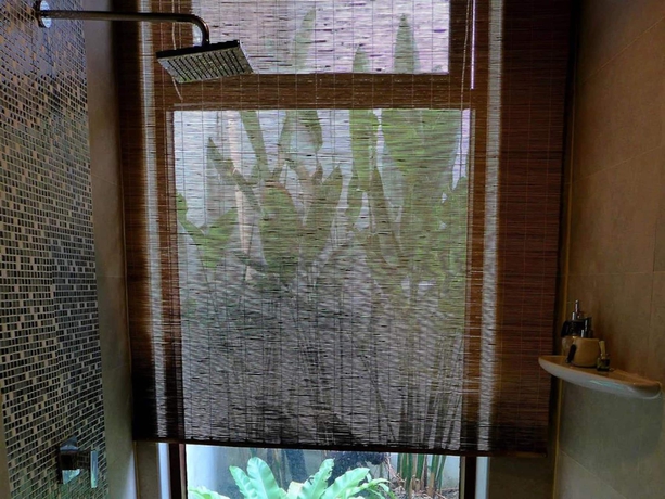 Imagen de la habitación del Hotel Yi's Garden Villa. Foto 19