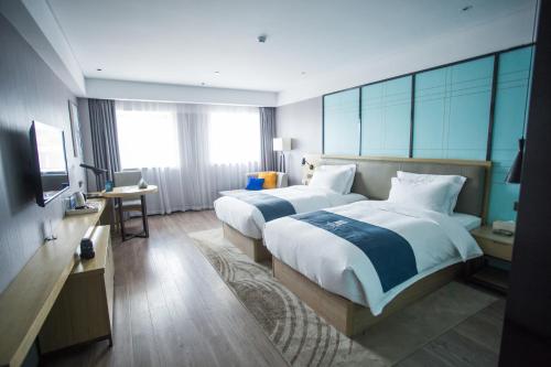 Imagen general del Hotel Yishang - Jingmen Yintai City Jingchu Institute of Technology. Foto 2