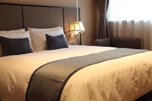 Imagen de la habitación del Hotel Yitel Shanghai Zhongshan Park. Foto 7