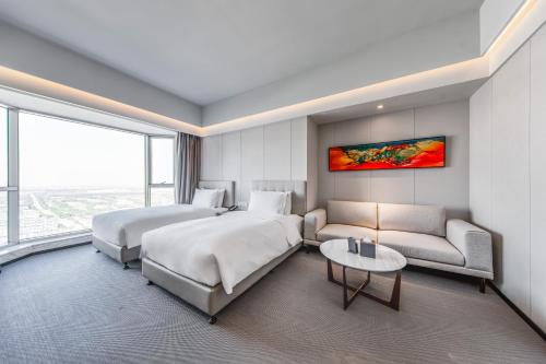 Imagen de la habitación del Hotel Yiwo Zhishang. Foto 12