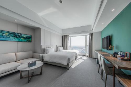 Imagen de la habitación del Hotel Yiwo Zhishang. Foto 13