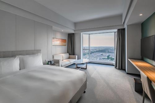 Imagen de la habitación del Hotel Yiwo Zhishang. Foto 14