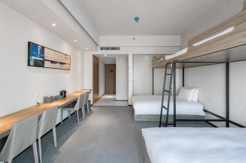 Imagen de la habitación del Hotel Yiwo Zhishang. Foto 15