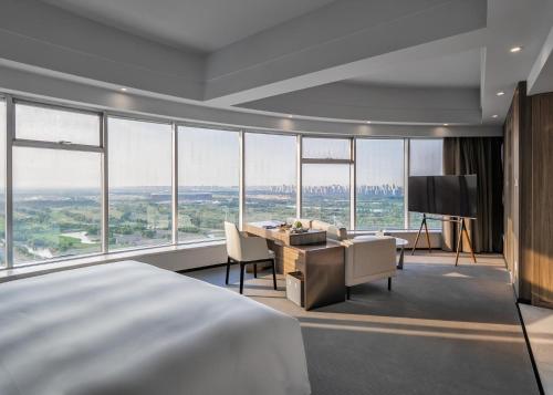 Imagen de la habitación del Hotel Yiwo Zhishang. Foto 16