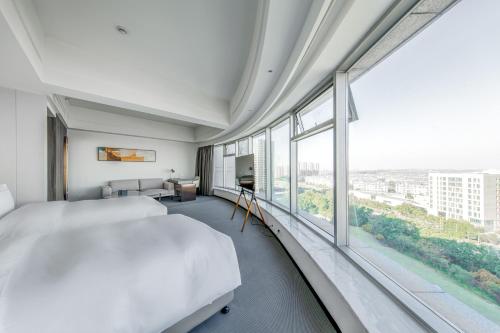 Imagen de la habitación del Hotel Yiwo Zhishang. Foto 17