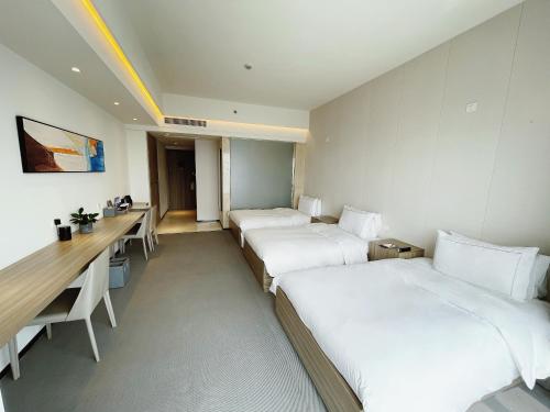 Imagen de la habitación del Hotel Yiwo Zhishang. Foto 19
