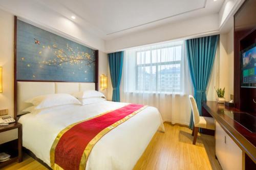 Imagen de la habitación del Hotel Yiwu Boting. Foto 15