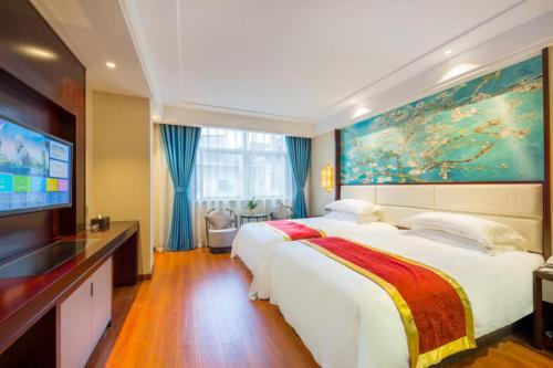 Imagen de la habitación del Hotel Yiwu Boting. Foto 16