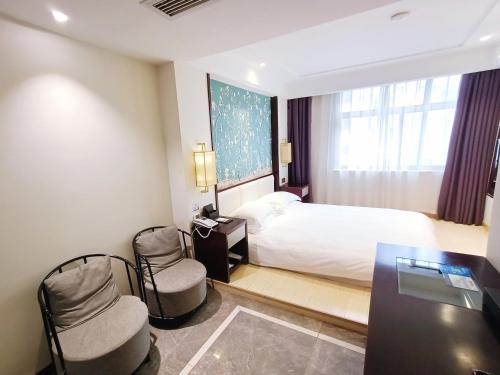 Imagen de la habitación del Hotel Yiwu Boting. Foto 18