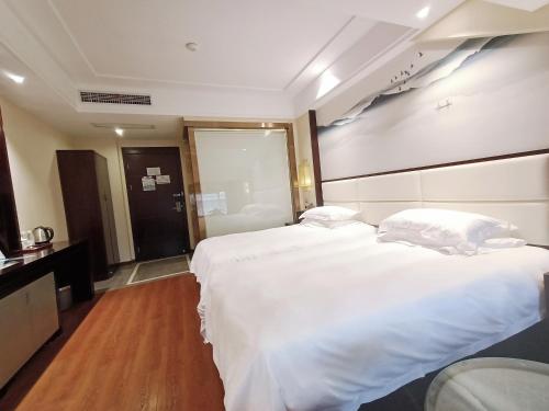 Imagen de la habitación del Hotel Yiwu Boting. Foto 19