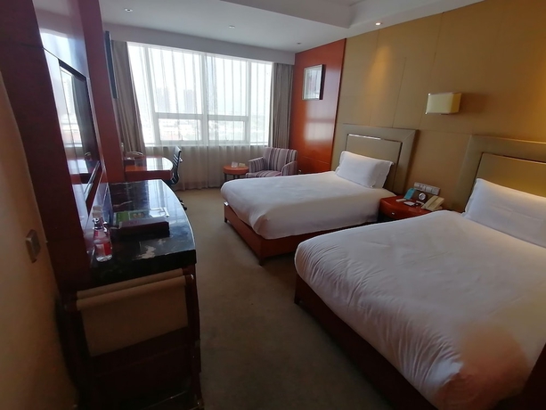Imagen de la habitación del Hotel Yiwu. Foto 3