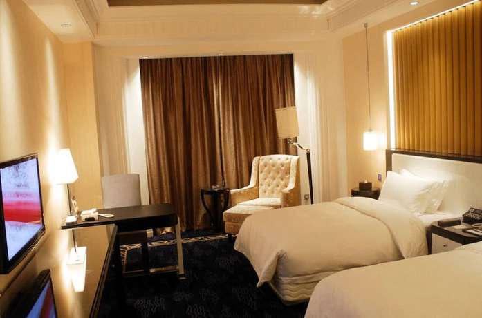 Imagen de la habitación del Hotel Yiwu Luck Bear. Foto 8