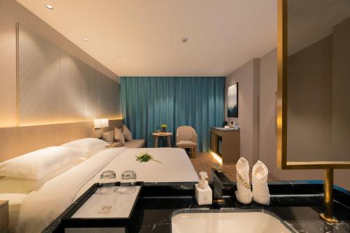 Imagen de la habitación del Hotel Yiwu Mankalan. Foto 16