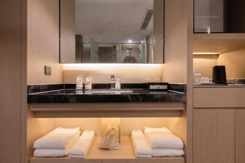 Imagen de la habitación del Hotel Yiwu Mankalan. Foto 17