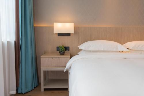 Imagen de la habitación del Hotel Yiwu Mankalan. Foto 18