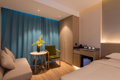 Imagen de la habitación del Hotel Yiwu Mankalan. Foto 19