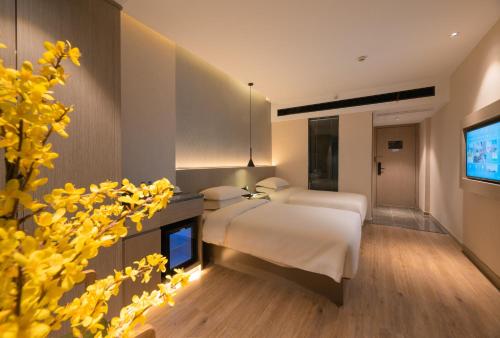 Imagen de la habitación del Hotel Yiwu Mankalan. Foto 20