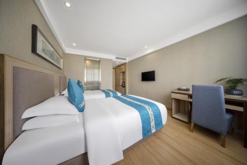 Imagen de la habitación del Hotel Yiwu Shangzhou - International Trade City. Foto 16