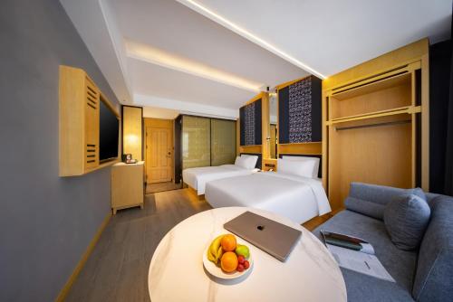 Imagen de la habitación del Hotel Yiwu WanYue International Holiday Inn. Foto 18