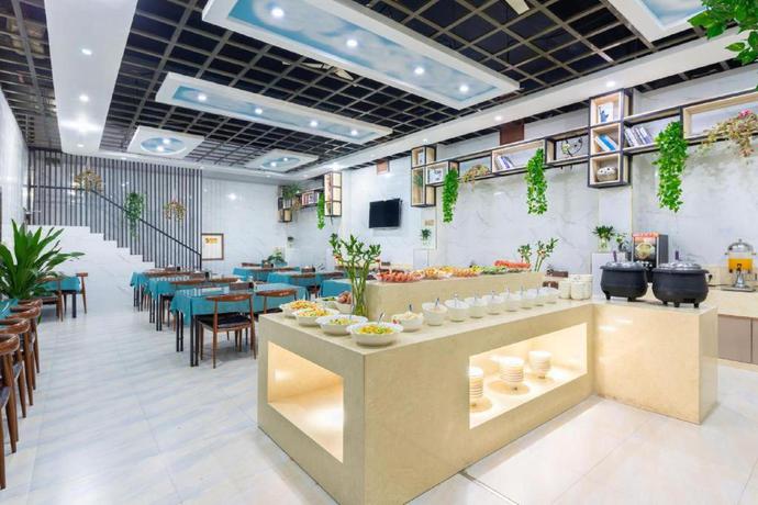 Imagen del bar/restaurante del Hotel Yiwu Yuejia Business Hotel. Foto 7