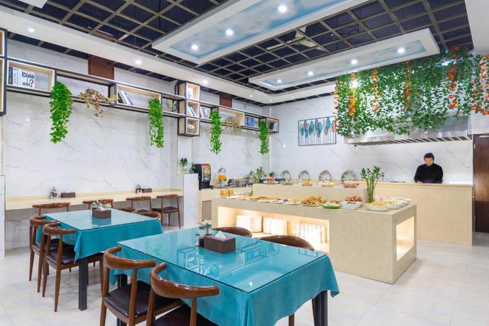 Imagen del bar/restaurante del Hotel Yiwu Yuejia Business Hotel. Foto 8