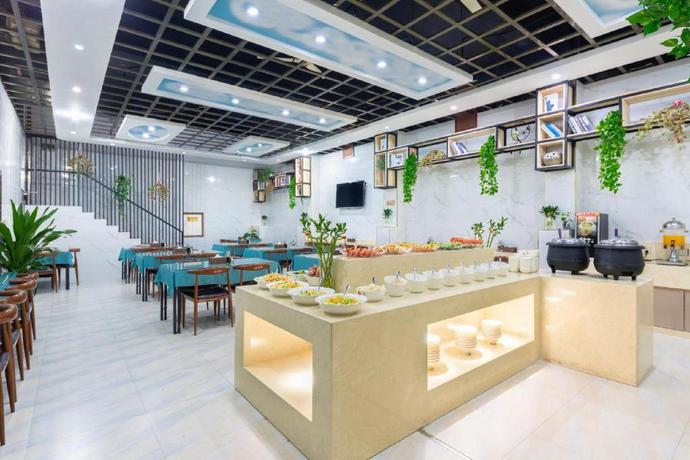 Imagen del bar/restaurante del Hotel Yiwu Yuejia Business Hotel. Foto 9