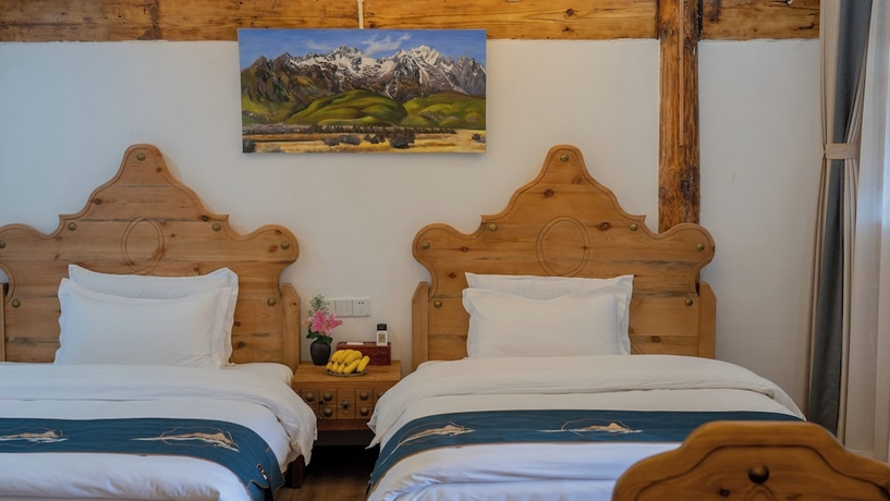 Imagen de la habitación del Hotel Yiyuan Snow Mountain View Historical Naxi House - Lijiang Old Town Mufu branch. Foto 4