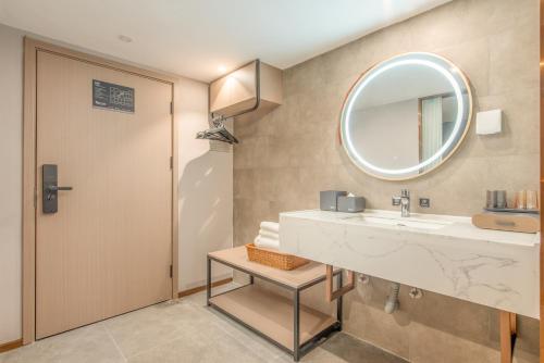 Imagen de la habitación del Hotel Yizhi - Guangzhou Tower Metro Station Pazhou Convention and Exhibition Center Branch. Foto 19