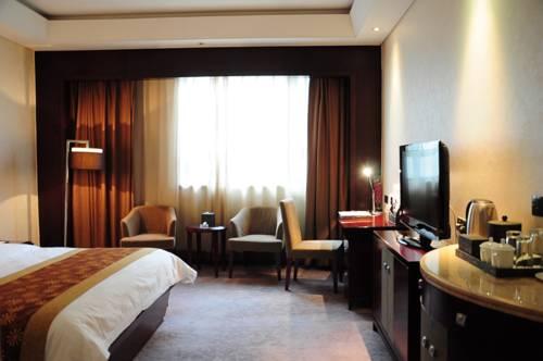 Imagen de la habitación del Hotel Yizui Crown Hotel. Foto 1