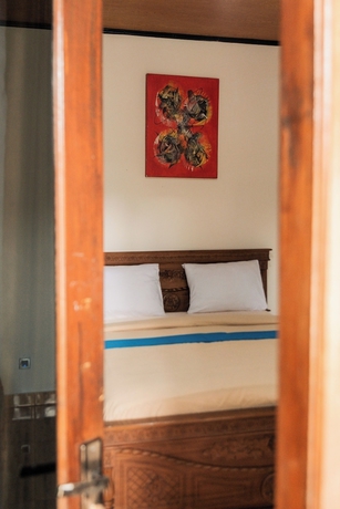 Imagen de la habitación del Hotel Yoki\'s Bungalows. Foto 4