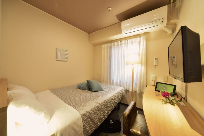 Imagen de la habitación del Hotel Yokohama Heiwa Plaza. Foto 4