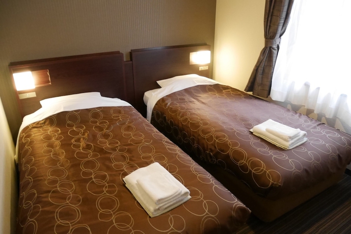 Imagen de la habitación del Hotel Yokohama Heiwa Plaza. Foto 13
