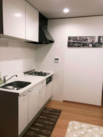 Imagen de la habitación del Hotel Yokohama World Family House. Foto 16