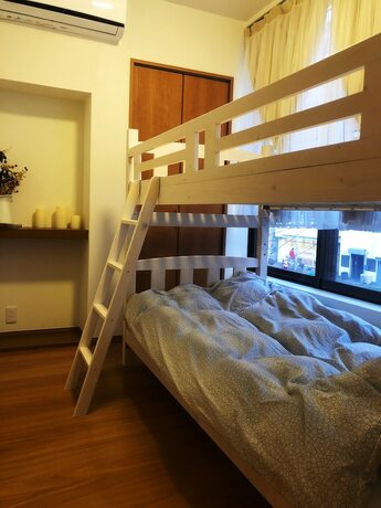 Imagen de la habitación del Hotel Yokohama World Family House. Foto 18