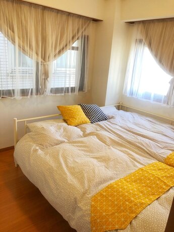 Imagen de la habitación del Hotel Yokohama World Family House. Foto 32