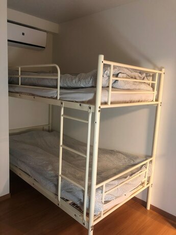 Imagen de la habitación del Hotel Yokohama World Family House. Foto 33