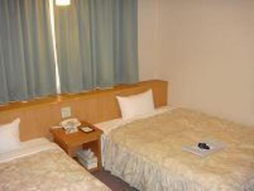 Imagen de la habitación del Hotel Yonago Universal. Foto 16