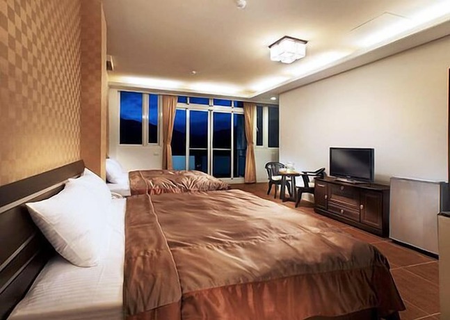 Imagen de la habitación del Hotel Yonghe Resort. Foto 13
