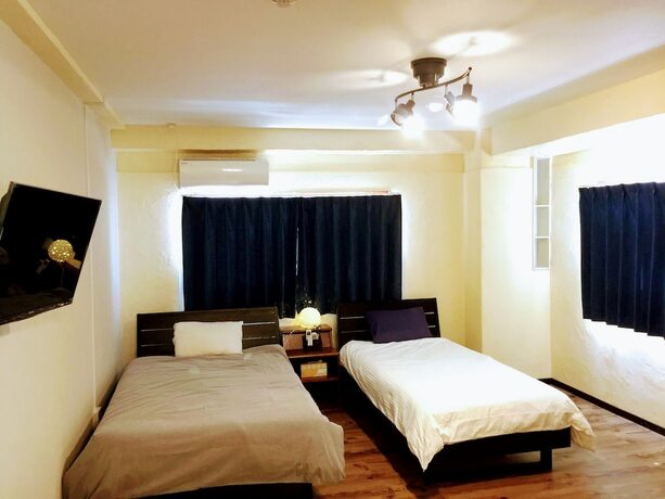 Imagen de la habitación del Hotel Yoron Tandy-house. Foto 19