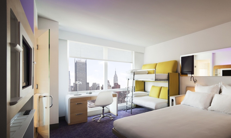 Imagen de la habitación del Hotel Yotel New York Times Square. Foto 8
