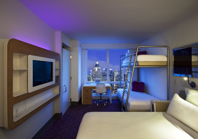 Imagen de la habitación del Hotel Yotel New York Times Square. Foto 12