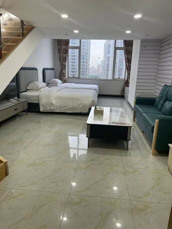 Imagen de la habitación del Hotel Yoyo International Apartment. Foto 23