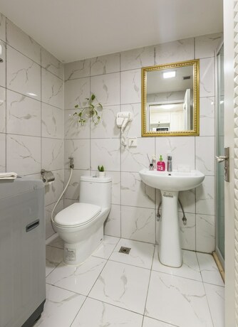 Imagen de la habitación del Hotel Yoyo International Apartment. Foto 24