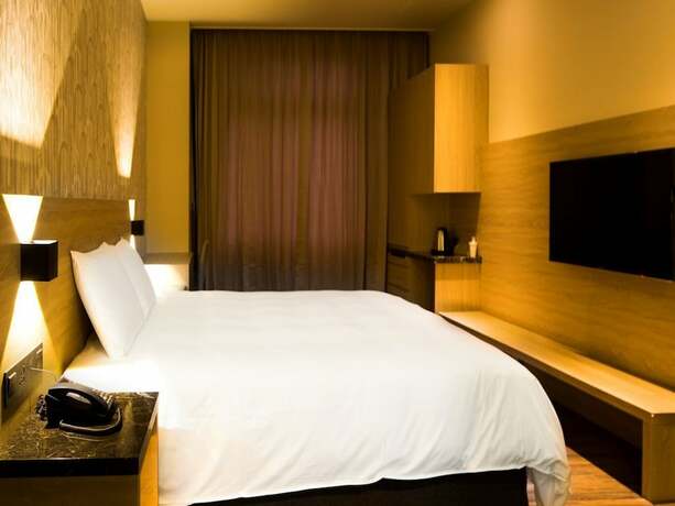 Imagen de la habitación del Hotel Yu Chun. Foto 26