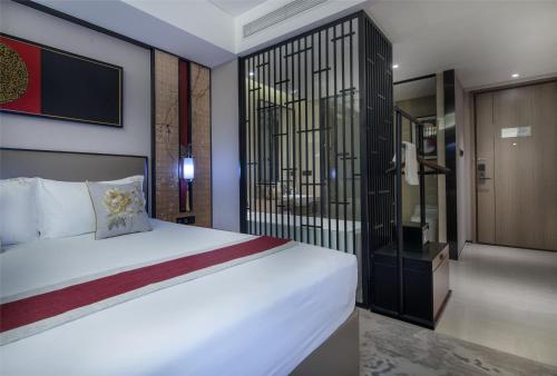 Imagen de la habitación del Hotel Yuan Culture Hotel Shenzhen World Shajing. Foto 8